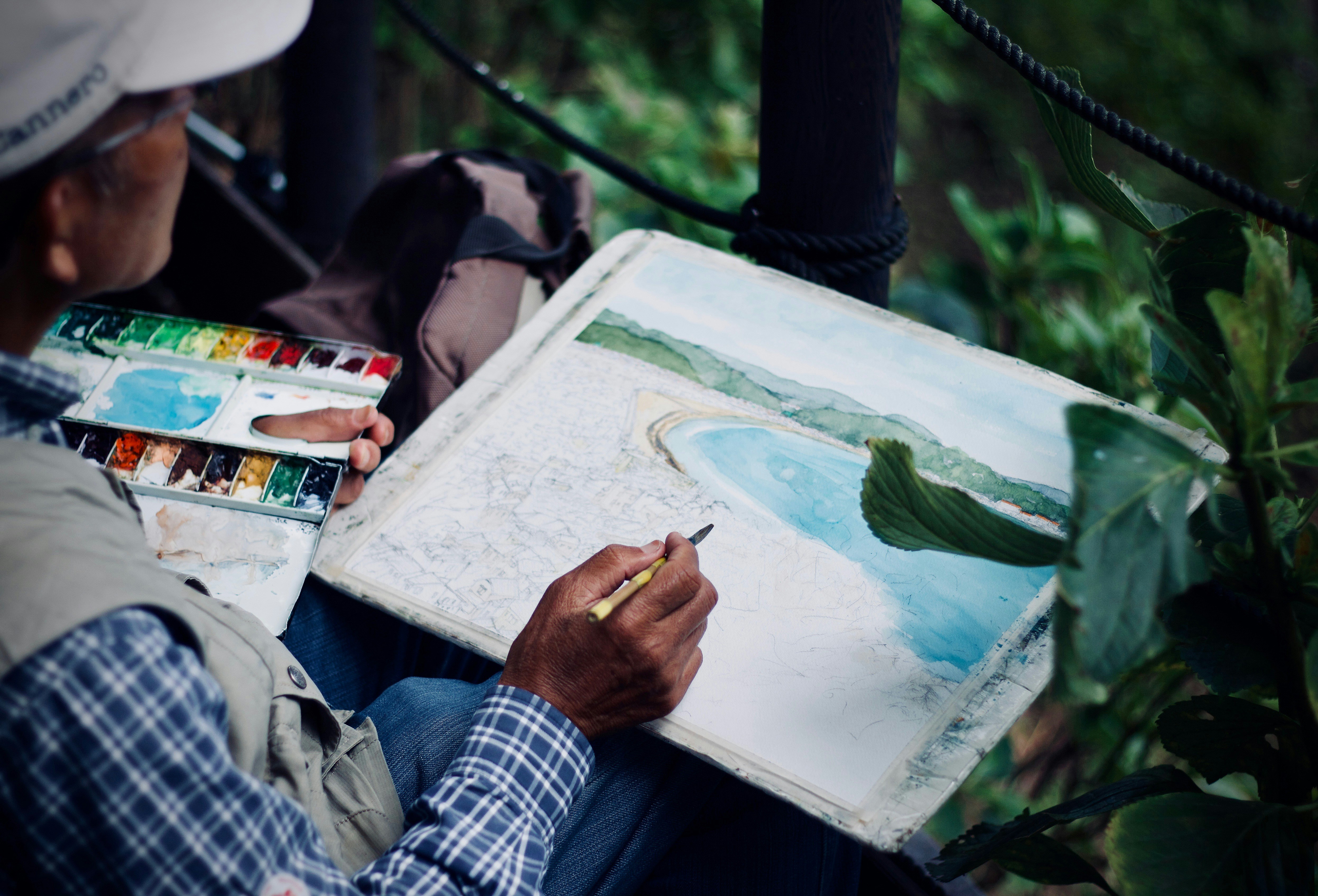 An artist painting outdoors.